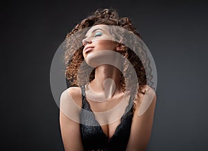 Portrait of a beautiful female fashion model with curly hair