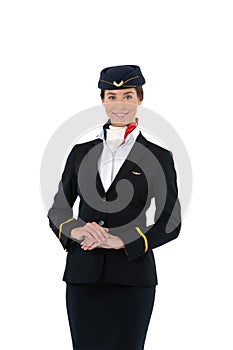 Portrait of a beautiful female flight attendant smiling isolated on white background