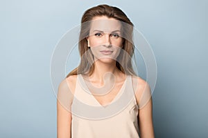 Portrait of beautiful female isolated on studio background