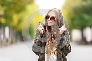 Portrait of a beautiful female model in autmn clothes outdoor. sensetive look.close up. Autumn fashin concept.