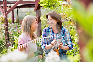 Portrait of beautiful gardeners walking while talking