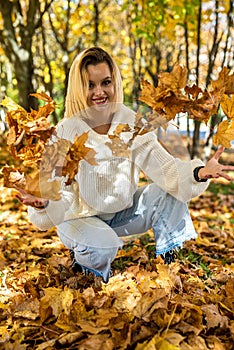 Portrait of beautiful girl in autumn park, spend and enjoy free time at nature