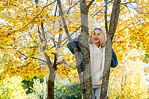 Portrait of beautiful girl in autumn park, spend and enjoy free time at nature