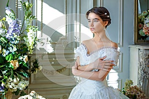 Portrait of a beautiful girl in a ball gown in the interior. Concept of tenderness and pure beauty in sweet princess look. Beautif