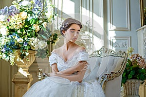 Portrait of a beautiful girl in a ball gown in the interior. Concept of tenderness and pure beauty in sweet princess look. Beautif