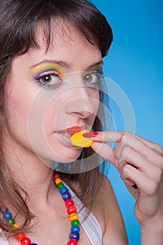 Portrait of beautiful girl with candies