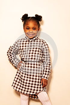 Portrait of beautiful girl in checkered dress