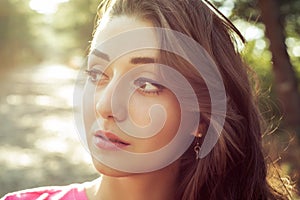 Portrait of beautiful girl close-up with sunlight