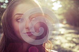 Portrait of beautiful girl close-up with sunlight