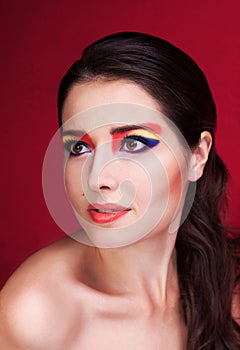Portrait of beautiful girl with colorful eyemakeup