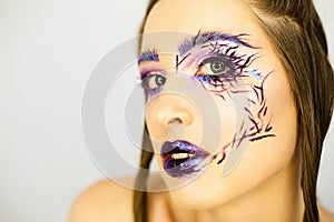 Portrait of beautiful girl with creative make up