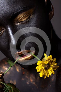 Portrait of a beautiful girl with a creative make-up, close-up.