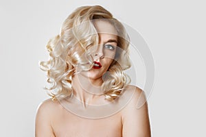 Portrait of beautiful girl with curly hair,  cat eye make-up, red lips. Concept mock up photo