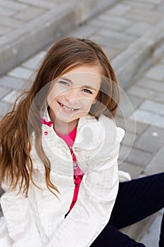 Portrait of beautiful girl with dark hair and brown eyes.