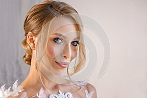 Portrait of a beautiful girl with delicate makeup and hair. image of the bride