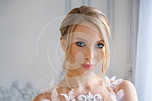 Portrait of a beautiful girl with delicate makeup and hair. image of the bride