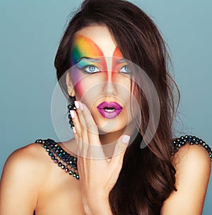 Portrait of a beautiful girl with a fashion bright multicolored