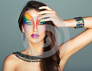Portrait of a beautiful girl with a fashion bright multicolored