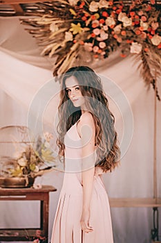 Portrait of beautiful girl in  flower gazebo