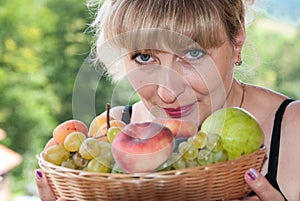 Portrait of a beautiful girl with fruit.