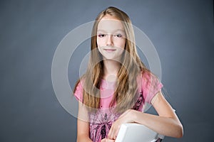 Portrait of a beautiful girl on a gray background