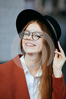Portrait of a beautiful girl in a hat and coat