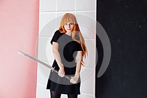 Portrait of a beautiful girl with a Japanese sword cosplayer anime Japan