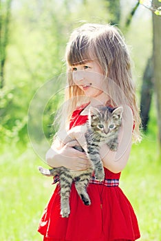 Portrait of beautiful girl with kitten.