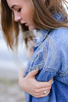 Portrait of beautiful girl with light smile on lips that poses o