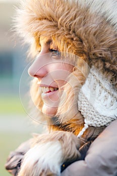 Portrait of the beautiful girl outdoor in winter