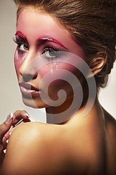 Portrait of beautiful girl with pink makeup