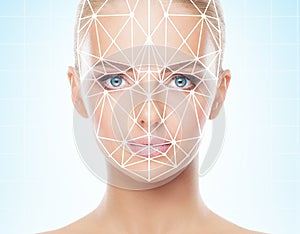 Portrait of beautiful girl with a scnanning grid on her face. Woman with face id scanner. Biometric verification