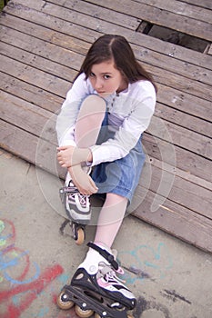 Portrait of beautiful girl with skates