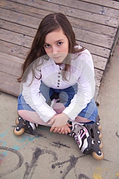 Portrait of beautiful girl with skates