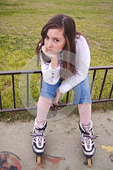 Portrait of beautiful girl with skates