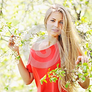 Portrait of a beautiful girl in spring summer park