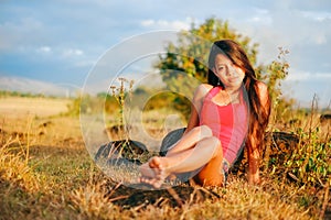 Portrait of a beautiful girl in summer field,Hot summer girl