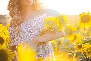 Portrait of the beautiful girl with a sunflowers