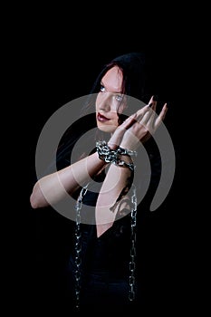 Portrait of beautiful girl tied in chains