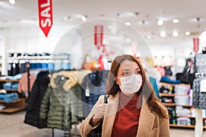 Portrait of beautiful girl wearing protective medical mask