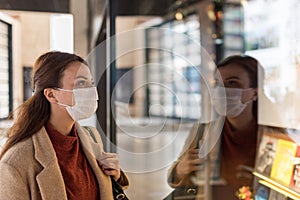 Portrait of beautiful girl wearing protective medical mask