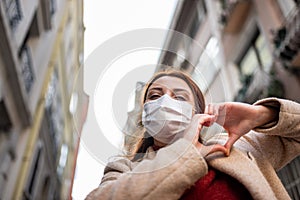 Portrait of beautiful girl wearing protective medical mask