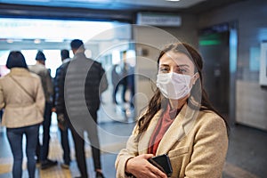 Portrait of beautiful girl wearing protective medical mask