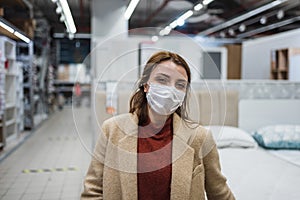 Portrait of beautiful girl wearing protective medical mask