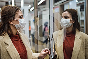 Portrait of beautiful girl wearing protective medical mask