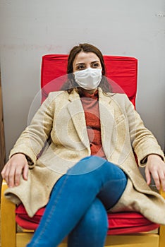 Portrait of beautiful girl wearing protective medical mask