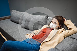 Portrait of beautiful girl wearing protective medical mask