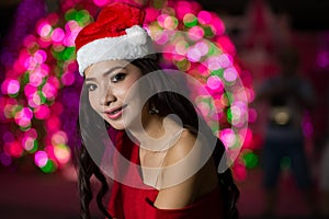 Portrait of beautiful girl wearing santa claus clothes