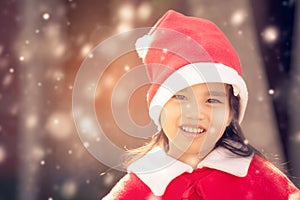 Portrait of beautiful girl wearing Santa Claus hat . photo