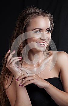 Portrait of a beautiful girl with wet hair